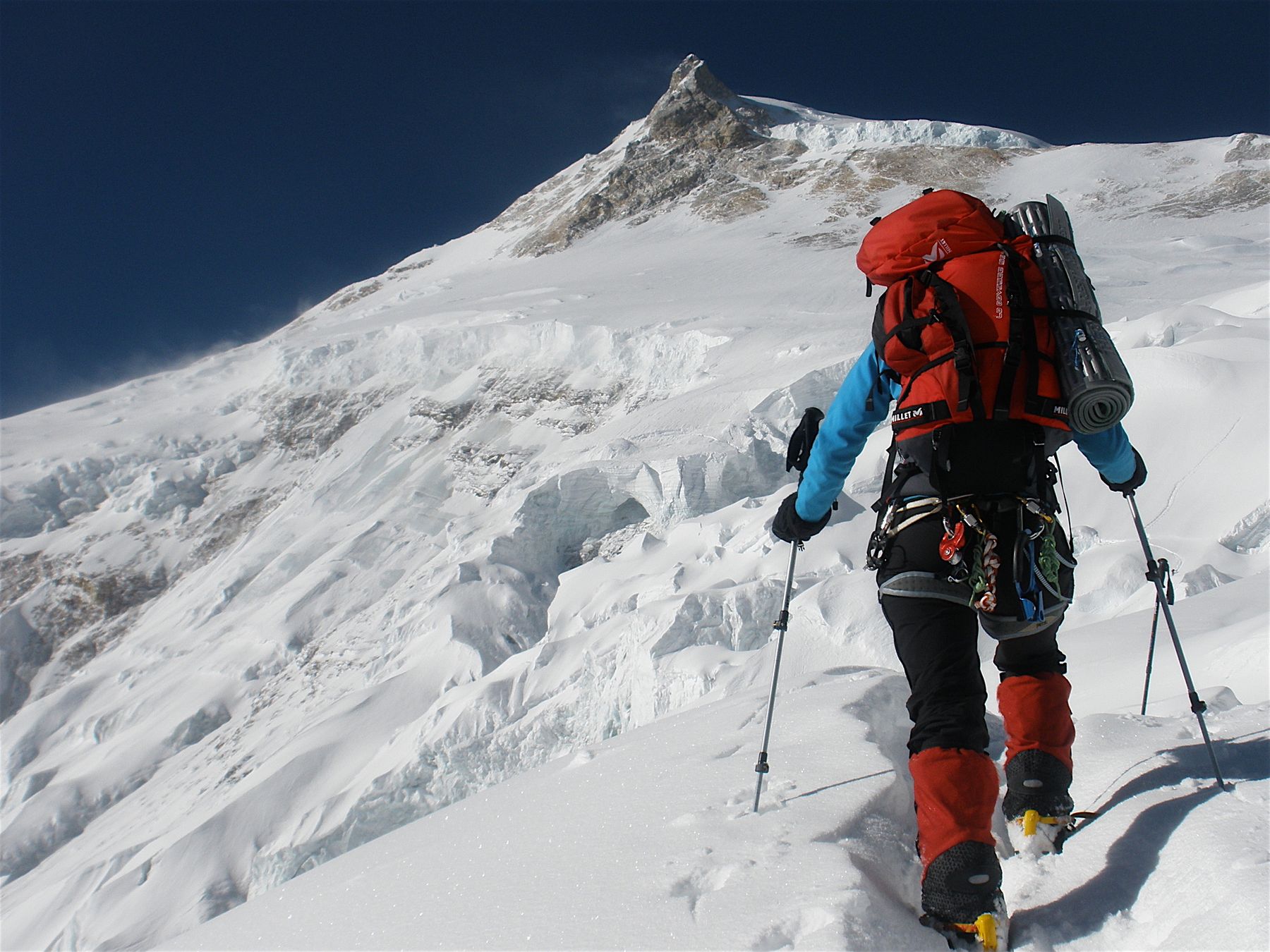 A climber on the 2009 expedition with Manaslu behind